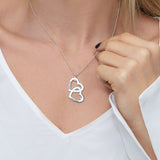 Personalized silver interlocking double heart diamond necklace with engraved names.