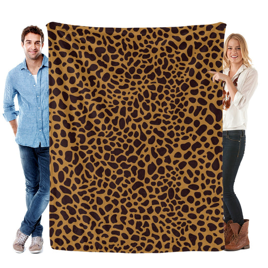 Animal skin pattern flannel blanket made in USA held by a man and a woman