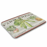 Coral velvet bath rug with farm fresh vegetables design: radishes, snap peas, and carrots. Non-slip and absorbent.