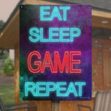 Metal sign with 'Eat Sleep Game Repeat' design, ideal for home office wall decor, game room accessory