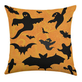Halloween linen pillow case set with black bats and ghosts on orange background, perfect for living room decor.