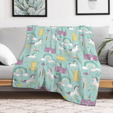 Rainbow Dream Fleece Blanket with unicorns, rainbows, and castles. Soft and warm, perfect for bed, sofa, and travel.