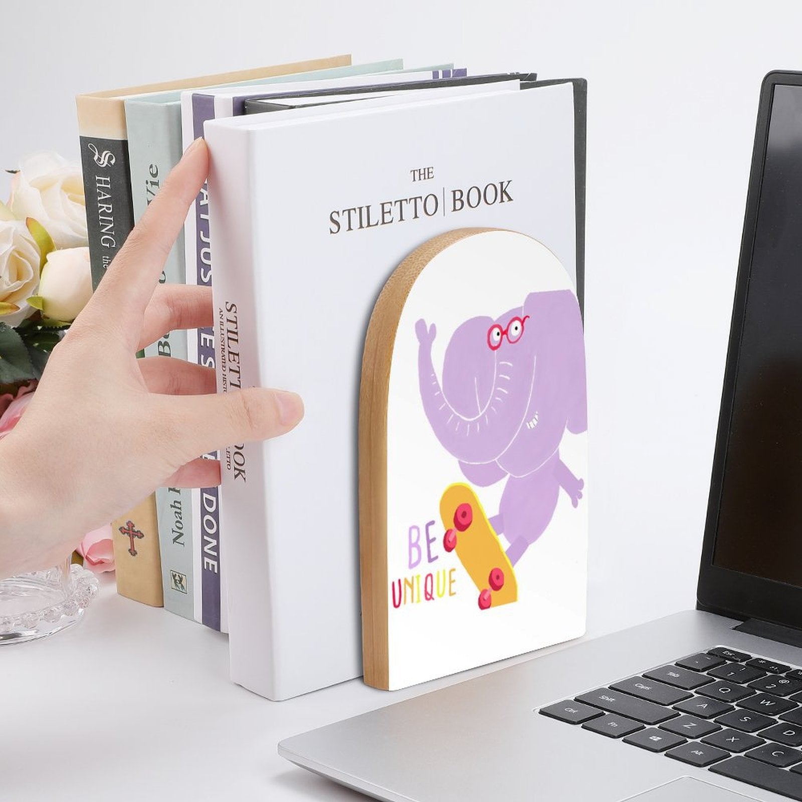 Beech wood bookends with elephant graphic and 'BE UNIQUE' text, perfect book holders for the library or office