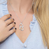 Personalized interlocking double heart necklace in silver, customized with engraved names, a perfect gift