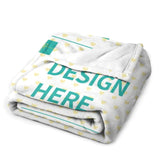 Custom fleece blanket, white with heart pattern, featuring 'DESIGN HERE' text. Cozy and warm for bed, sofa, travel.