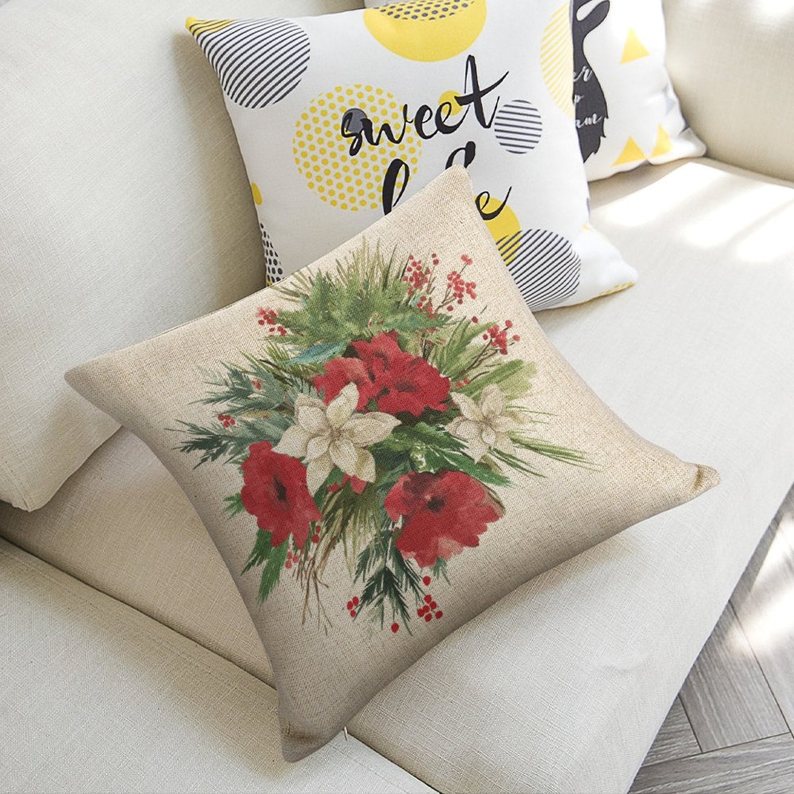 Christmas pillow with floral design on linen, perfect for couch. Features the phrase 'sweet love'.