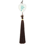 Customizable glass car pendant with a heart shape, featuring "YOUR DESIGN HERE" and brown tassel.