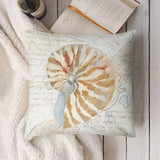 Nautilus shell throw pillow cover, soft plush, decorative design, MyArtsyGift, for couch or sofa. With a book.