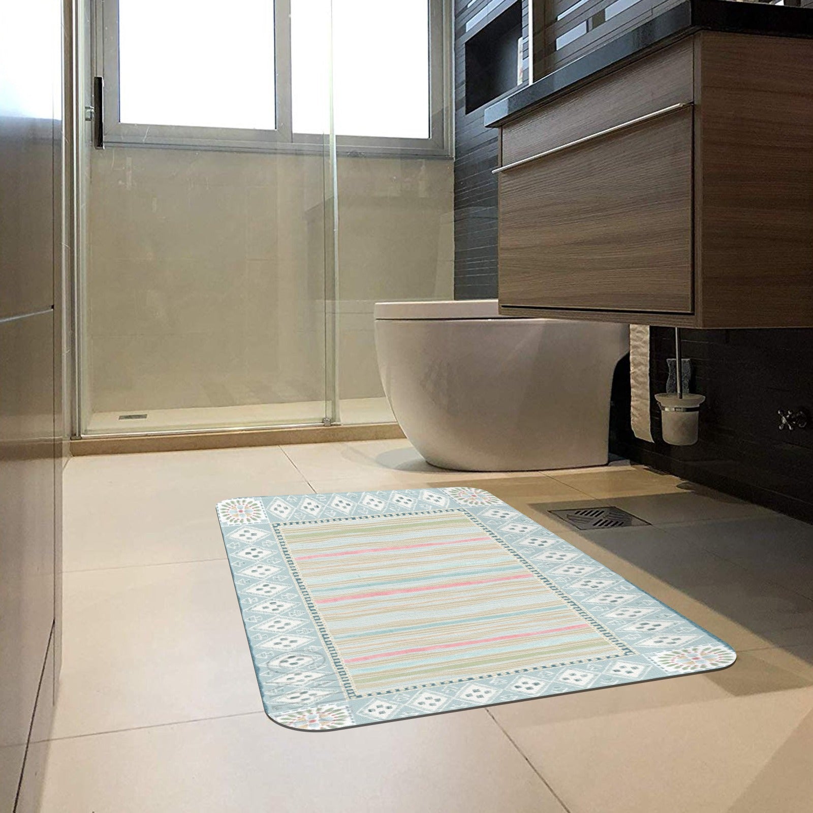Geometric pastel striped bathroom mat in front of a toilet, suitable for indoor use