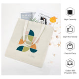 Canvas tote bag featuring Mid Century Geo II design, cotton blend, Wild Apple logo, high capacity for shopping.
