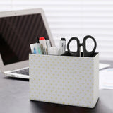 Heart-patterned pen holder on desk with office supplies. PU leather desk organizer for office and school supplies.