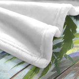 White flannel blanket with abstract palm tree design, soft polyester material