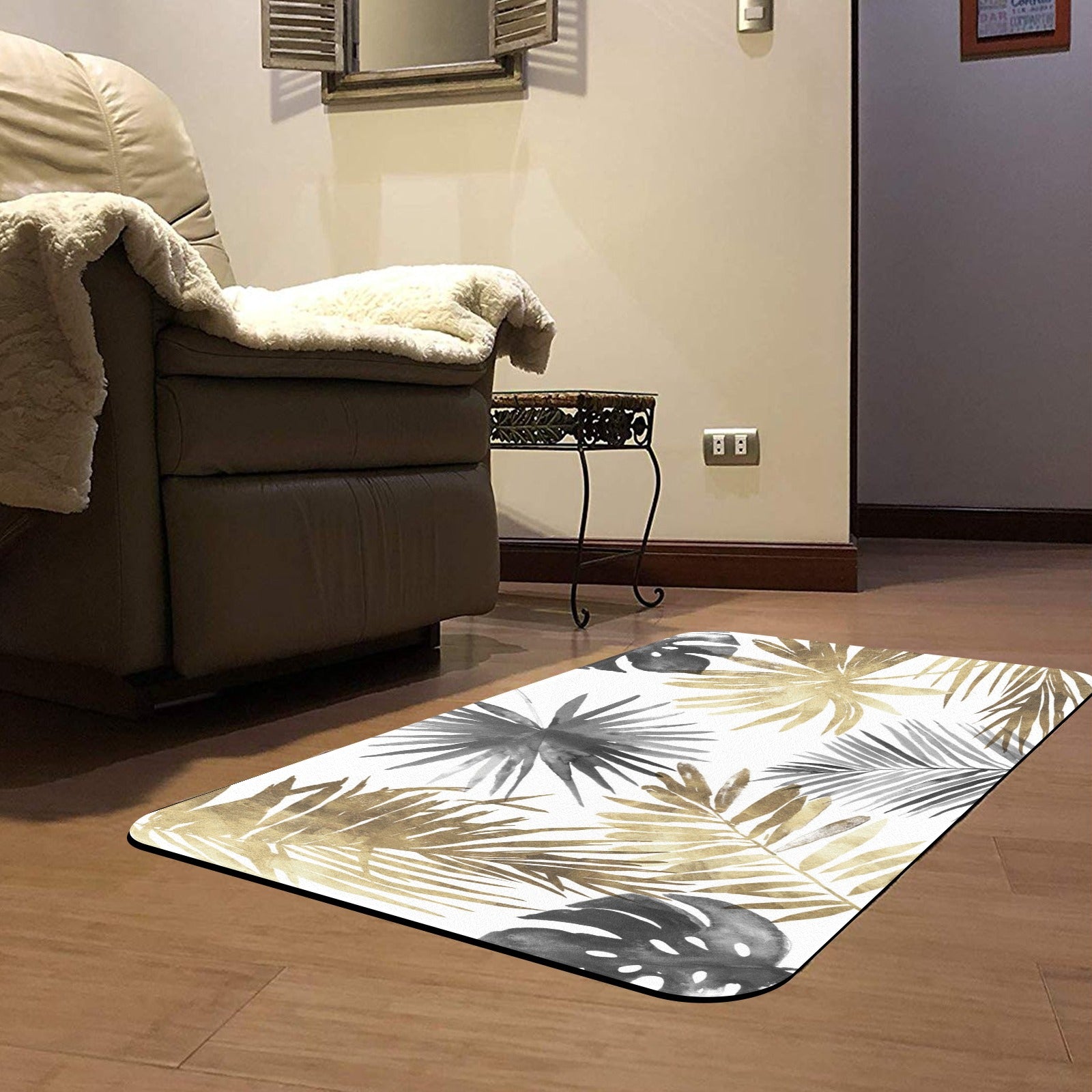 Tropical leaves doormat, rubber floor mat with gold, gray, and black leaf design for entrance.