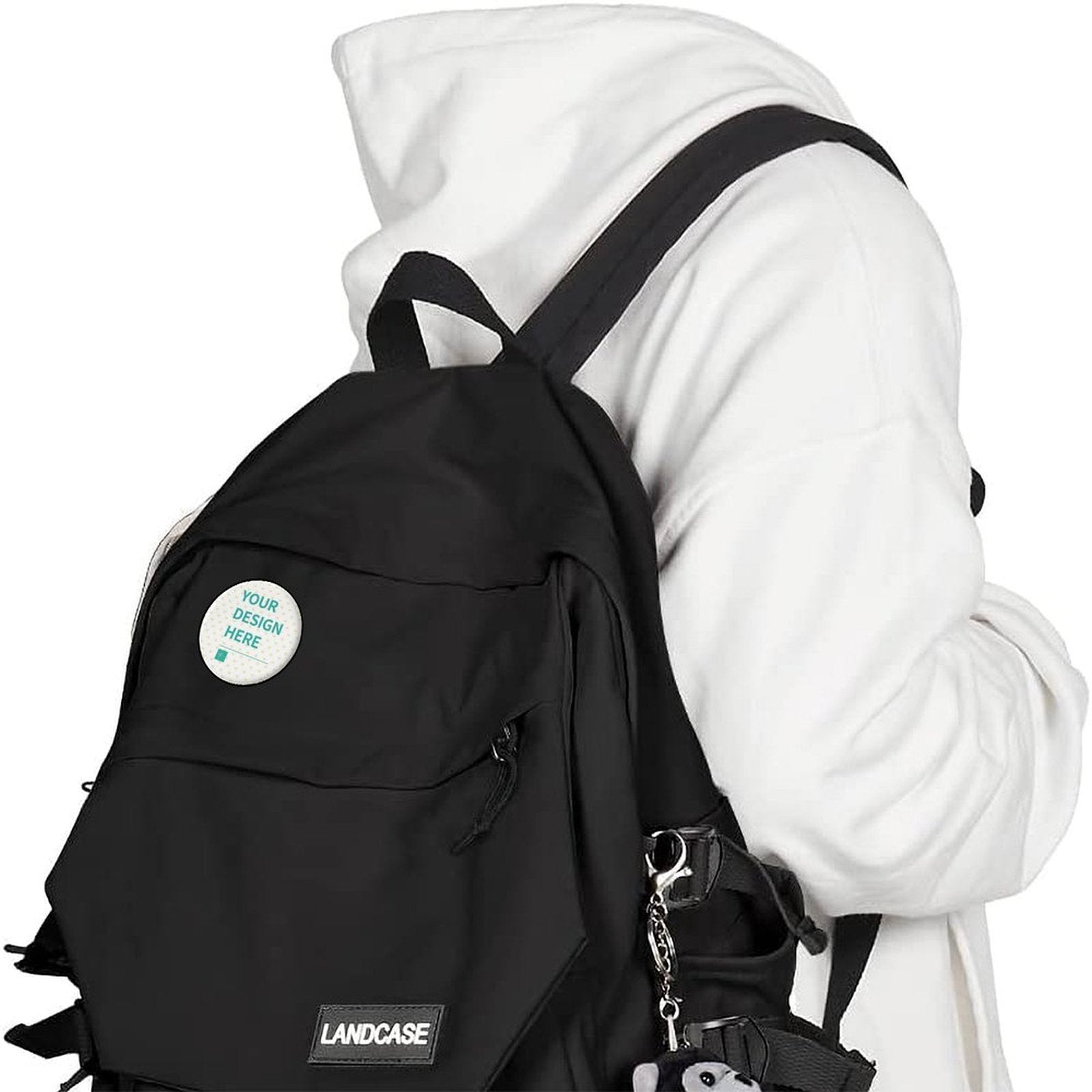 Customizable badge on black backpack, featuring 'YOUR DESIGN HERE' text, ideal for personalization and gifts, MyArtsyGift.