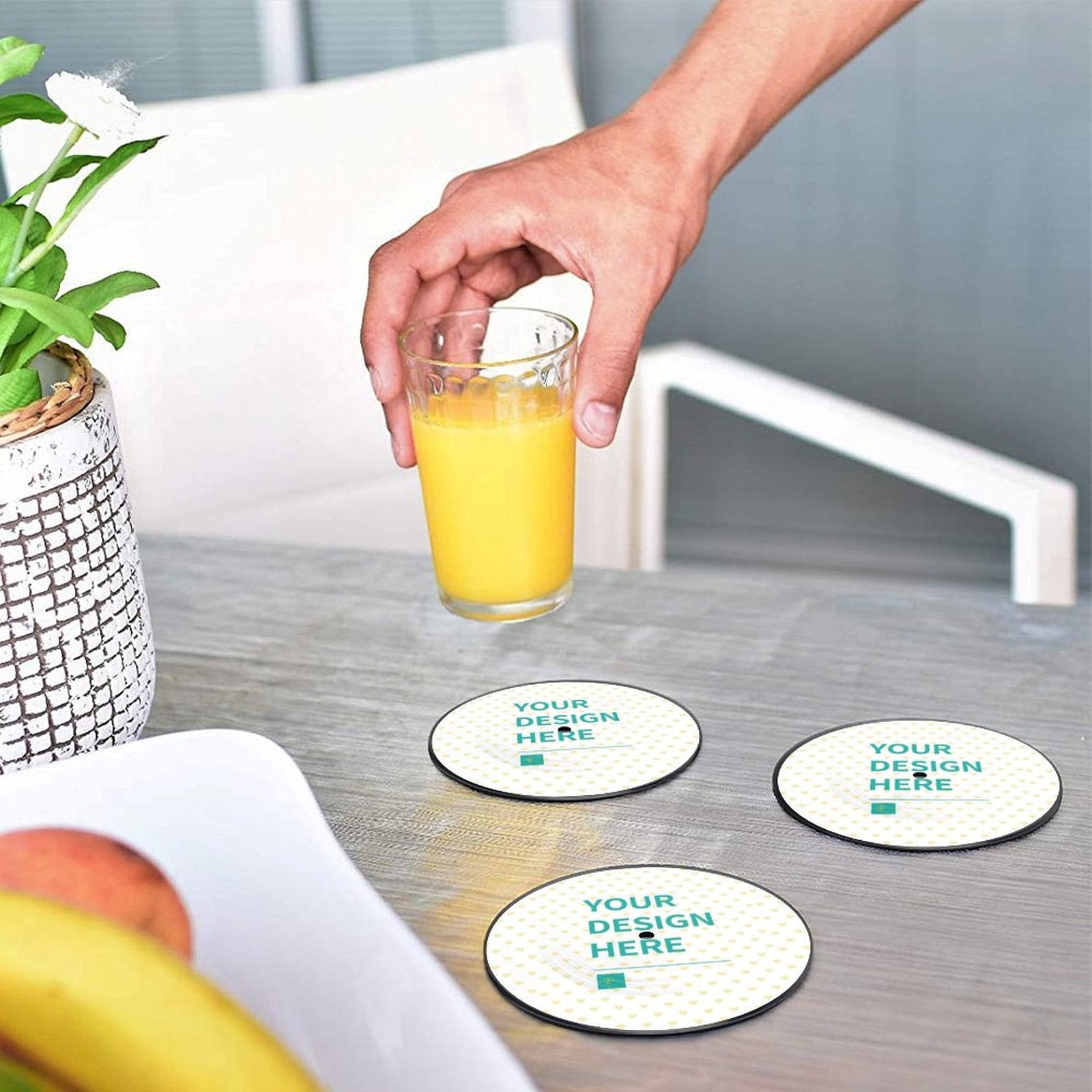 Customizable coasters with "YOUR DESIGN HERE" text, perfect for drinks at home or office, personalized design