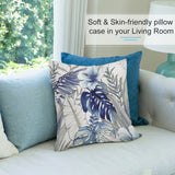 Blue floral plush pillow cover in a living room, soft and skin-friendly. Tropical leaf design on sofa, decorative pillow.
