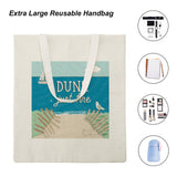Canvas tote bag with beach graphic and "DUNE just fine" text, eco-friendly cloth shopping bag.