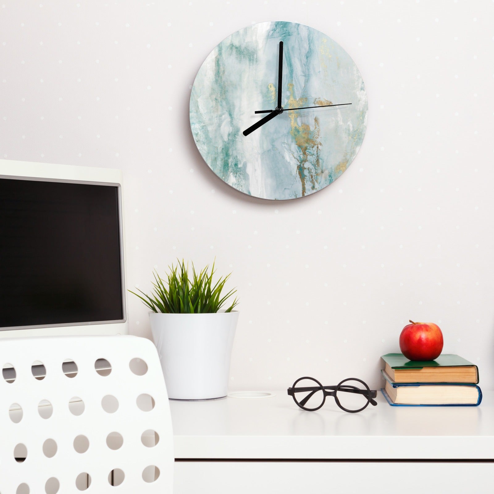 Modern blue MDF wall clock for living room decor with gold accents on a white desk setting