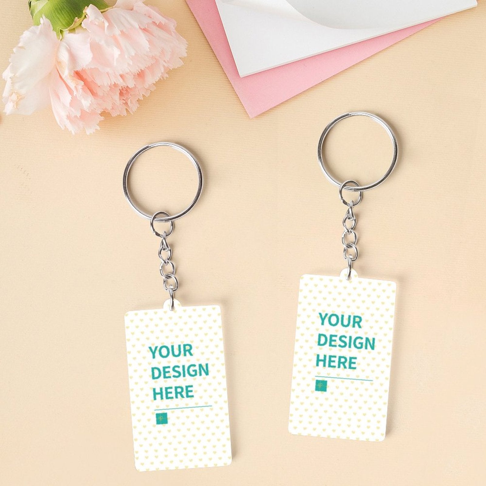 Customizable acrylic keychains with 'Your Design Here' text, perfect for personalized gifts.