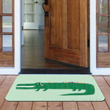 Green crocodile door mat at an open door entrance, durable for indoor/outdoor use, home decor.