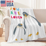 Penguin flannel blanket with "YOU ARE LOVED" text. Made in USA, super soft and cozy
