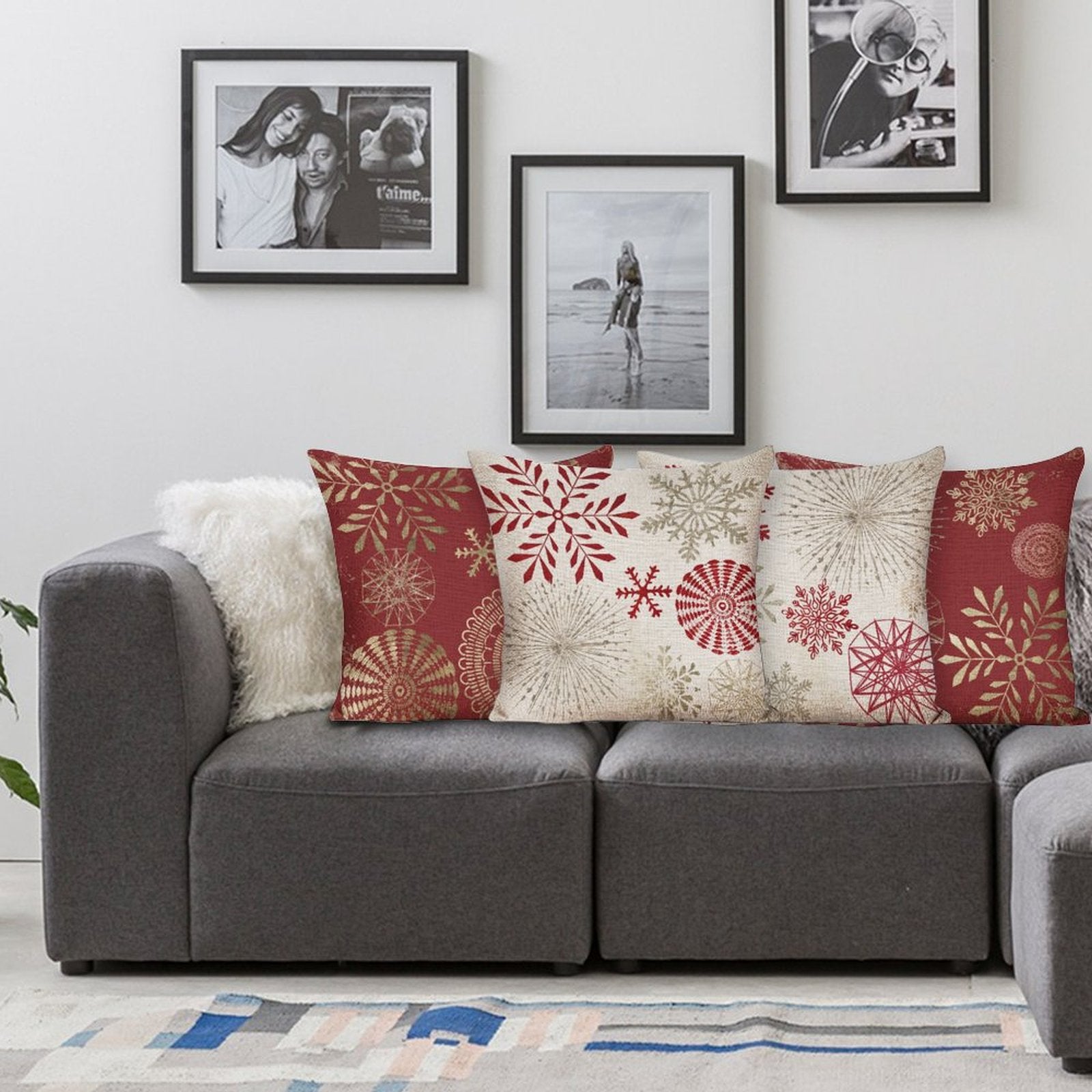Cotton linen pillow cases with red and gold snowflake patterns on a sofa, decorative pillows for bedroom or living room decor