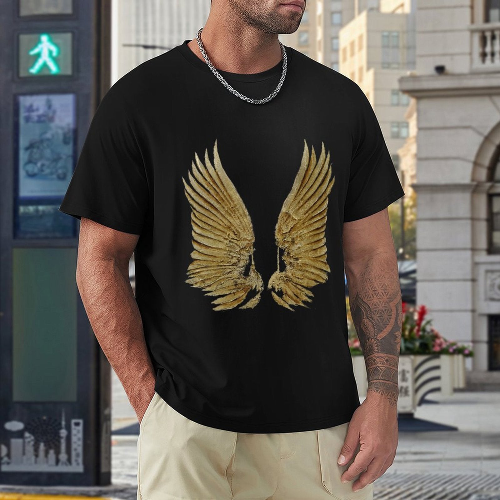 Black men's t-shirt featuring a golden wings print, crew neck, suitable for casual wear. Available in various sizes.