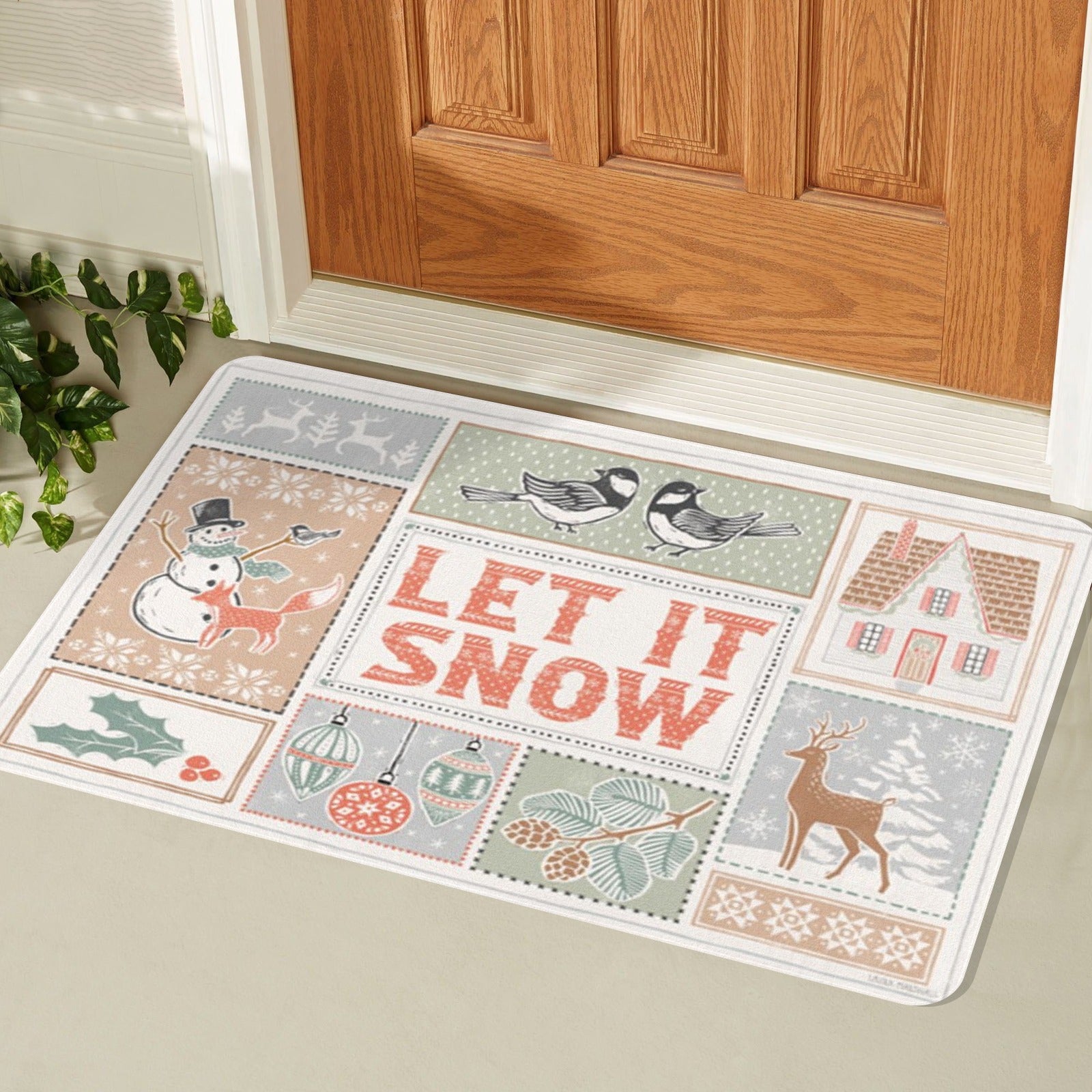 White rubber doormat with "LET IT SNOW" design, winter themed, for front door