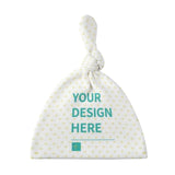 Custom baby beanie hat, white flannel top knot with "YOUR DESIGN HERE" design, perfect for newborns.