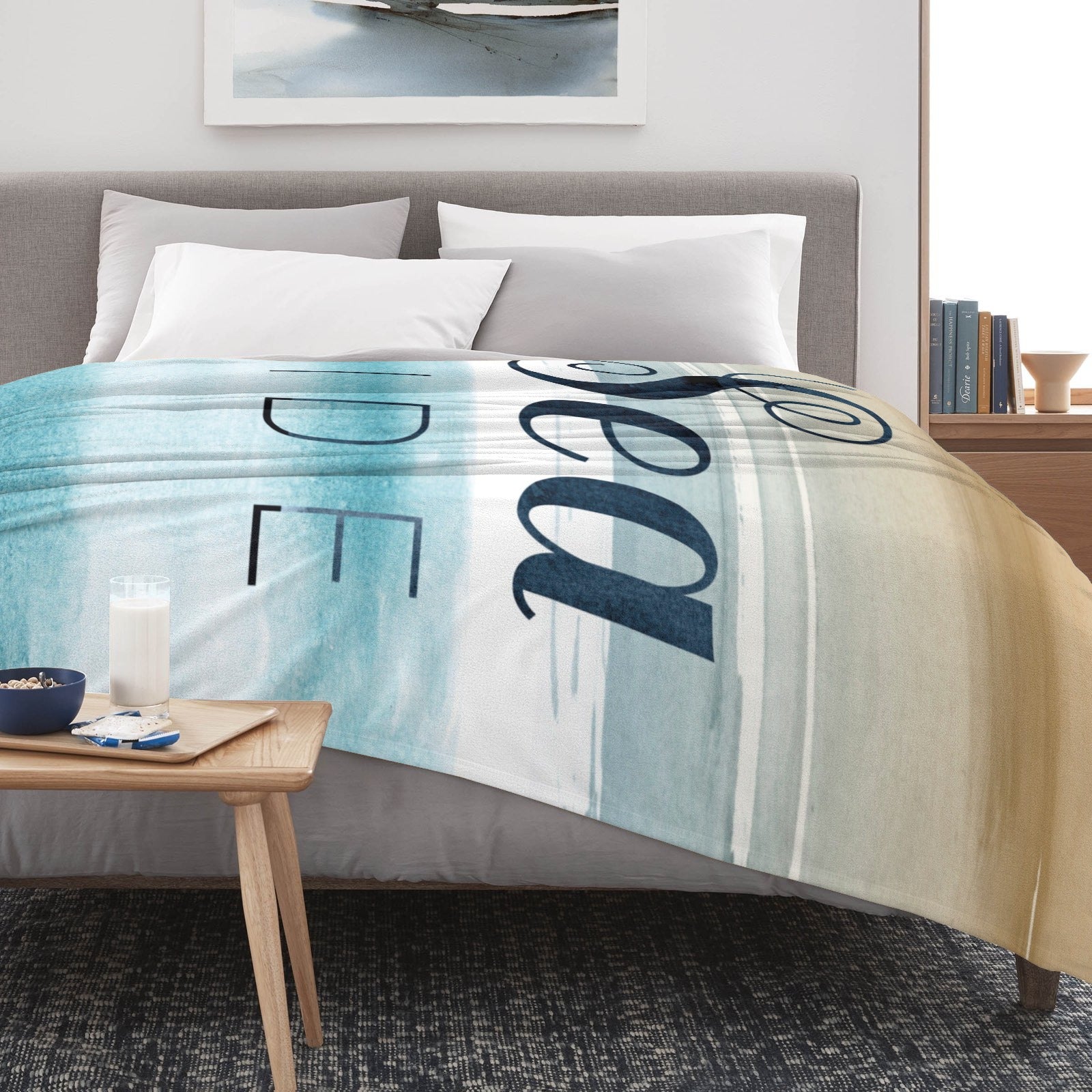 Beach Blue Seaside Flannel Blanket on bed, soft watercolor design, text 'Sea Side', perfect for couch use.