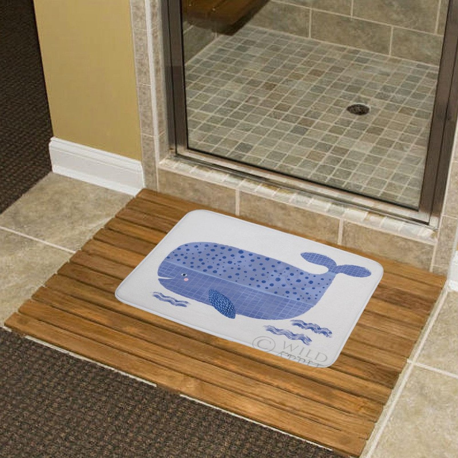 Blue whale design coral velvet bath rug, non-slip, ideal for bathroom or kitchen use. © WILD logo.