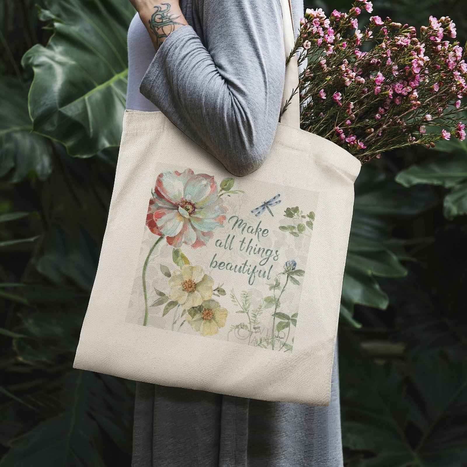 Canvas tote bag with floral design and 'Make all things beautiful' quote, perfect for shopping.