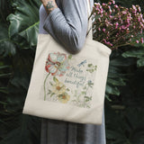 Canvas tote bag with floral design and 'Make all things beautiful' quote, perfect for shopping.