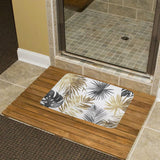 Coral velvet bath rug with gold and gray palm leaf design, non-slip wooden floor mat