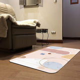 Pink abstract doormat with geometric design, ideal for indoor or outdoor use, rubber backing