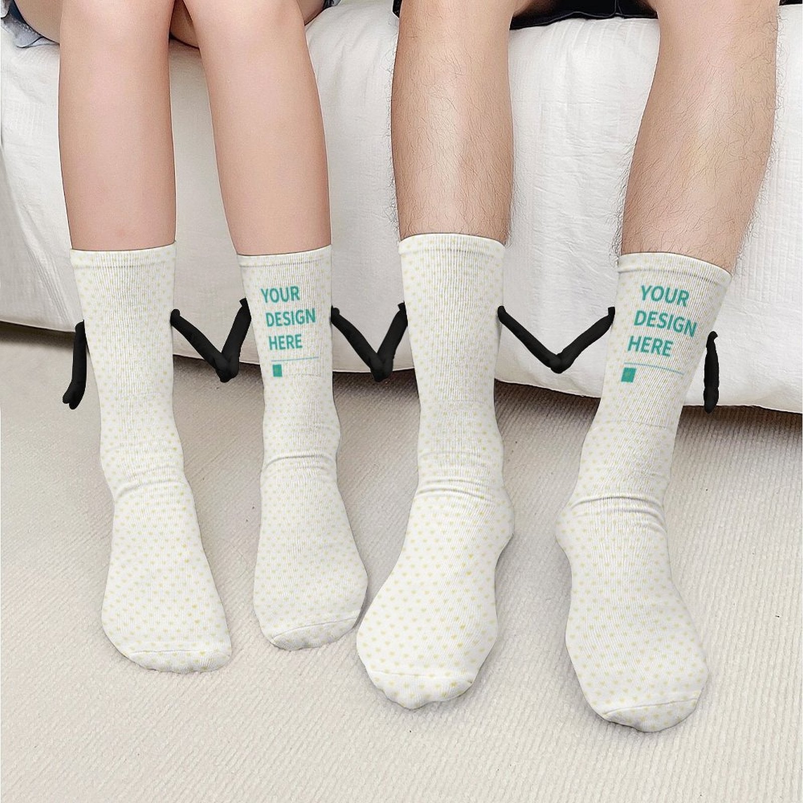Customizable holding hands socks with 'YOUR DESIGN HERE' text, perfect gift for couples. White socks made of polyester fiber.