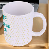 Customizable white ceramic mug with yellow hearts and 'YOUR DESIGN HERE' text; a perfect personalized gift.