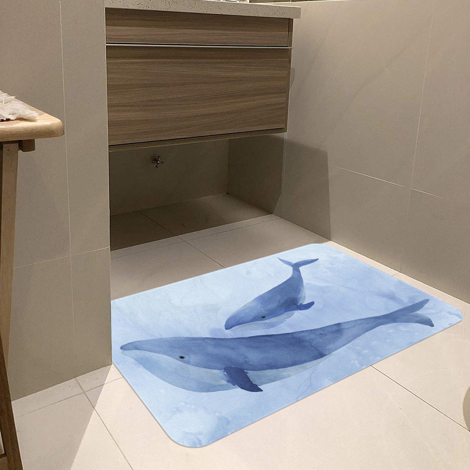 Blue Whale II doormat in a bathroom setting. Indoor/outdoor rubber mat with watercolor whale design for home decor.