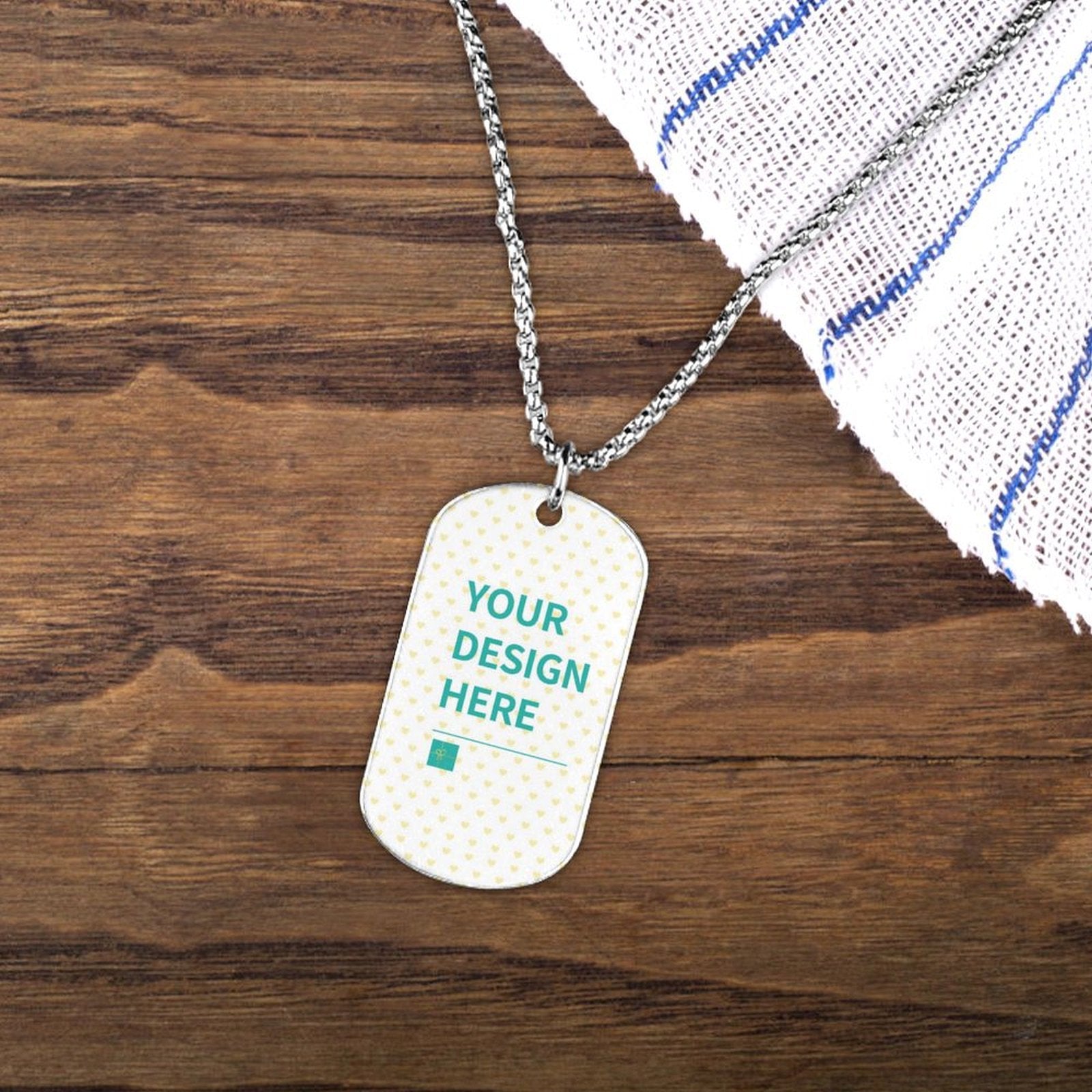 Customizable titanium steel dog tag necklace with 'YOUR DESIGN HERE' text, perfect for personalization.