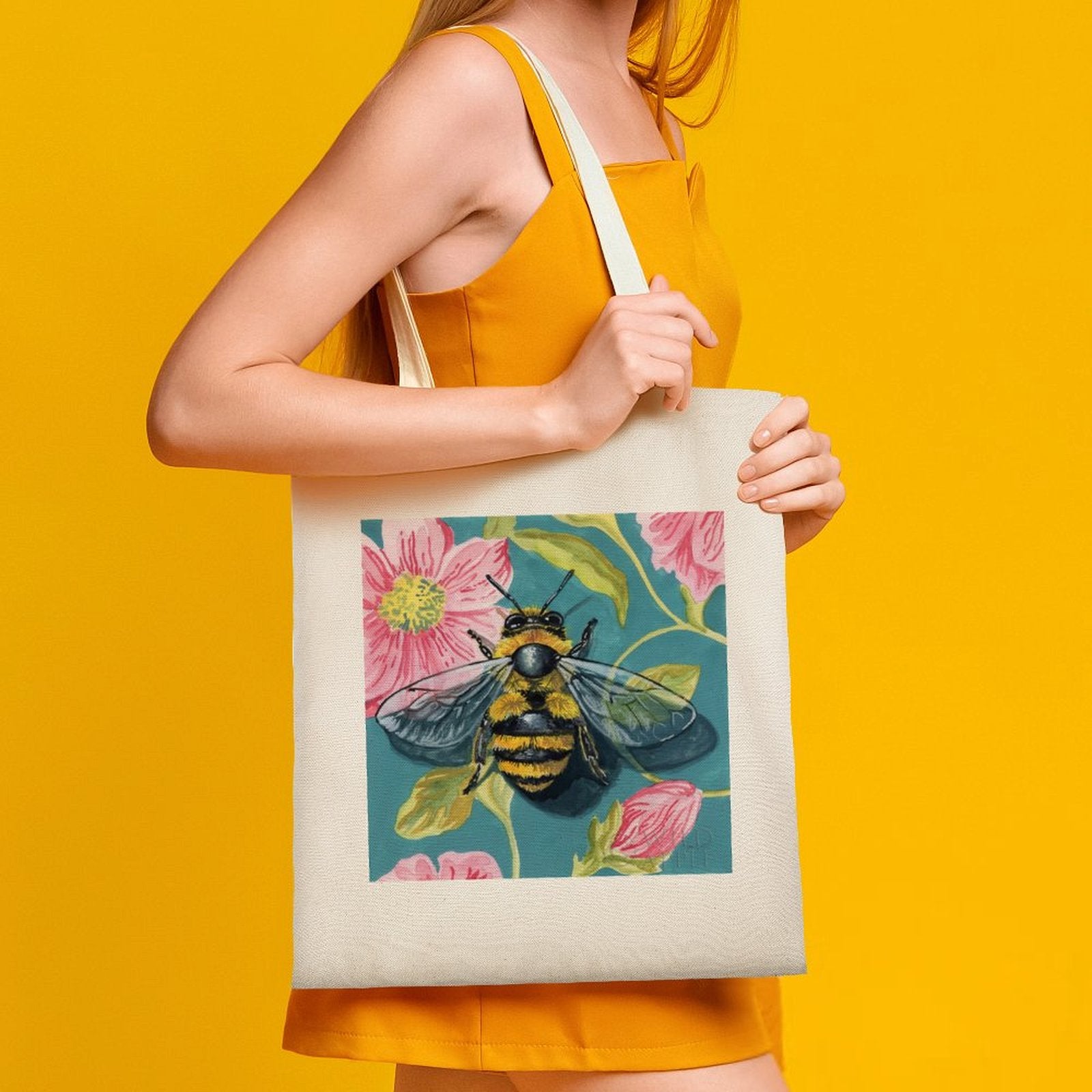 Personalized canvas tote bag with fuzzy bee and floral design. Eco-friendly and reusable cloth bag for shopping.