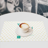 Custom placemat with yellow heart pattern, PVC material, and coffee cup, perfect for dining table decor, MyArtsyGift