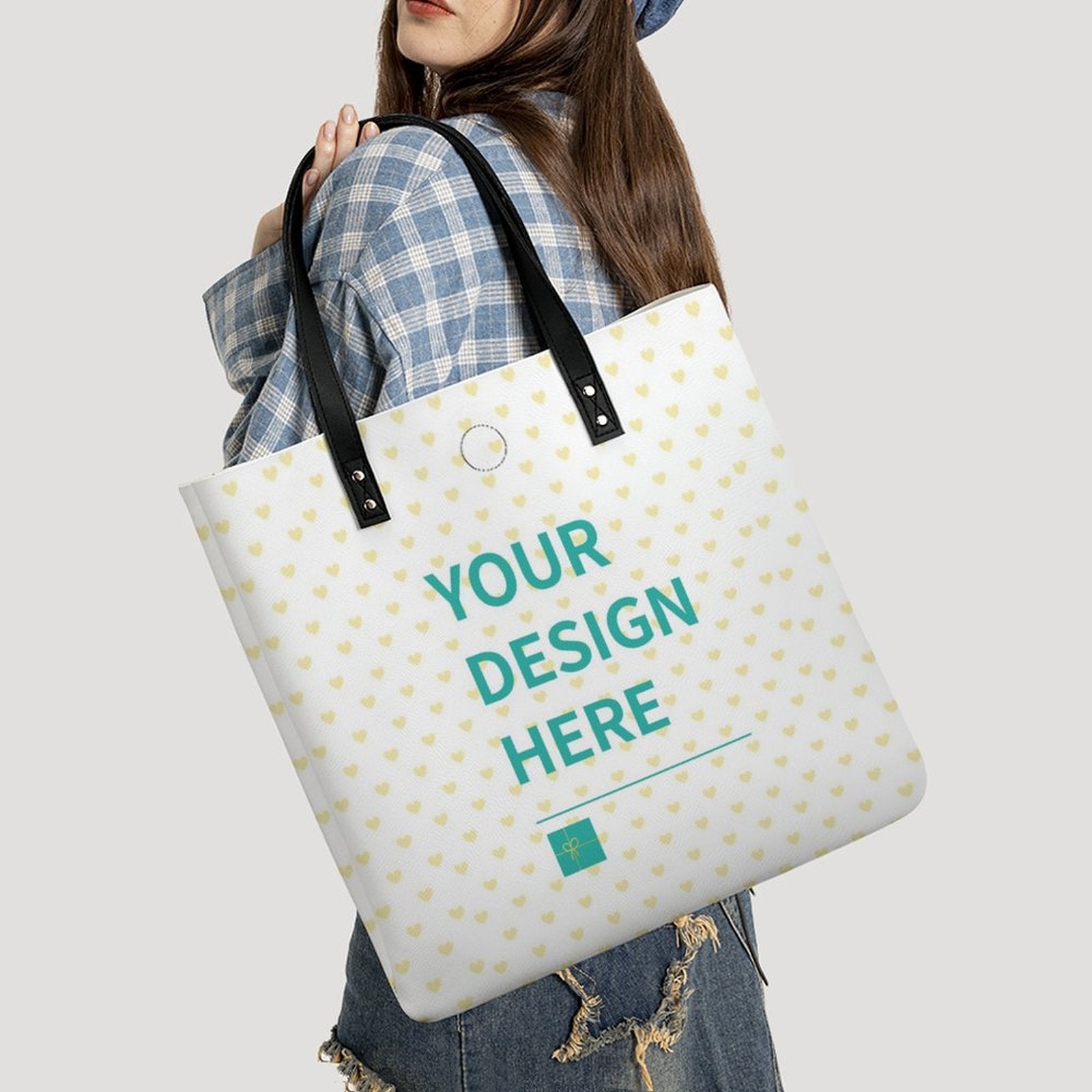 Customizable PU leather tote bag with 'YOUR DESIGN HERE' text, perfect for work and shopping, with heart pattern.