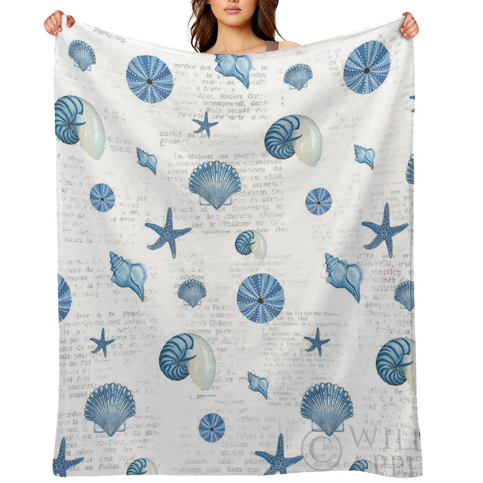 Navy shell pattern fleece blanket featuring seashells and starfish, soft and cozy