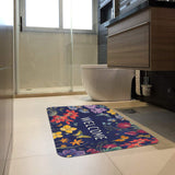 Dark blue butterfly and floral welcome door mat for indoor/outdoor use in a bathroom