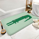 Coral velvet bath rug with green alligator design, non-slip bathroom floor mat