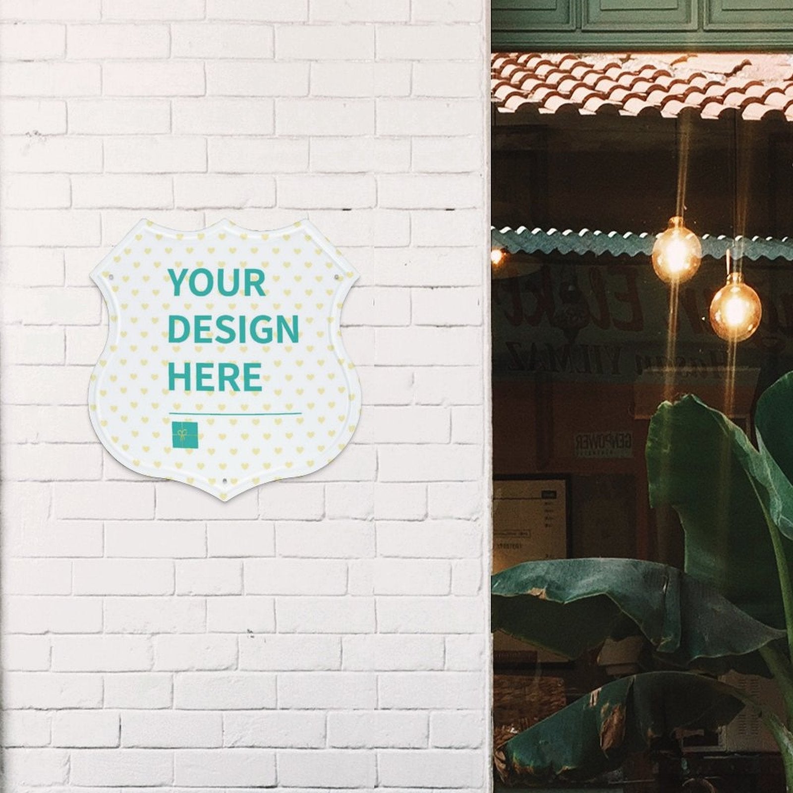 Custom shield-shaped metal sign with 'YOUR DESIGN HERE' for cafe or shop decor