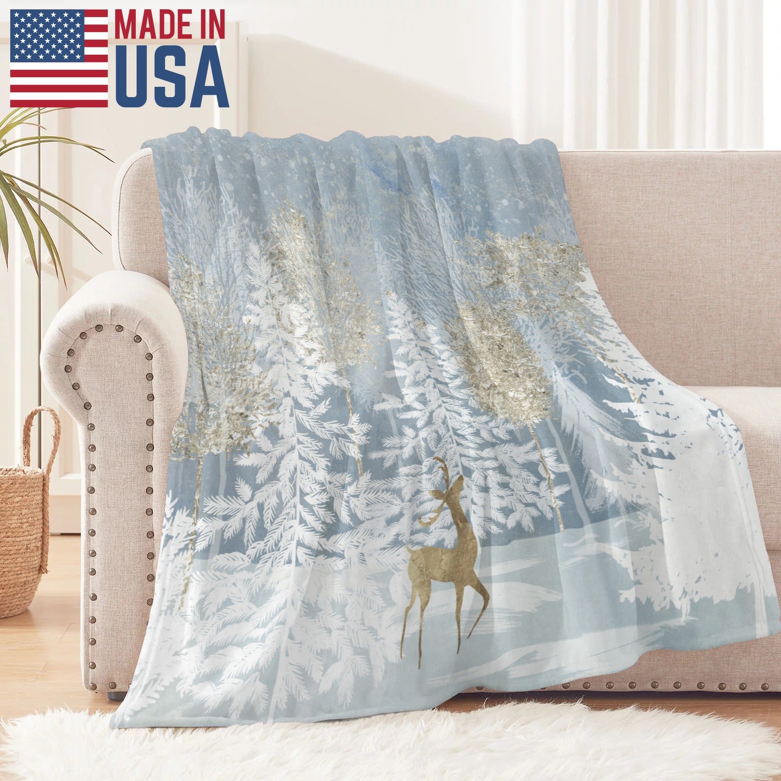 Blue winter forest flannel blanket made in USA, featuring deer and snowy trees, perfect for sofa and bed.