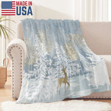 Blue winter forest flannel blanket made in USA, featuring deer and snowy trees, perfect for sofa and bed.