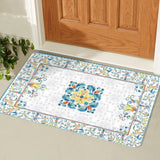 Mediterranean entrance doormat with floral design in front of a wooden door