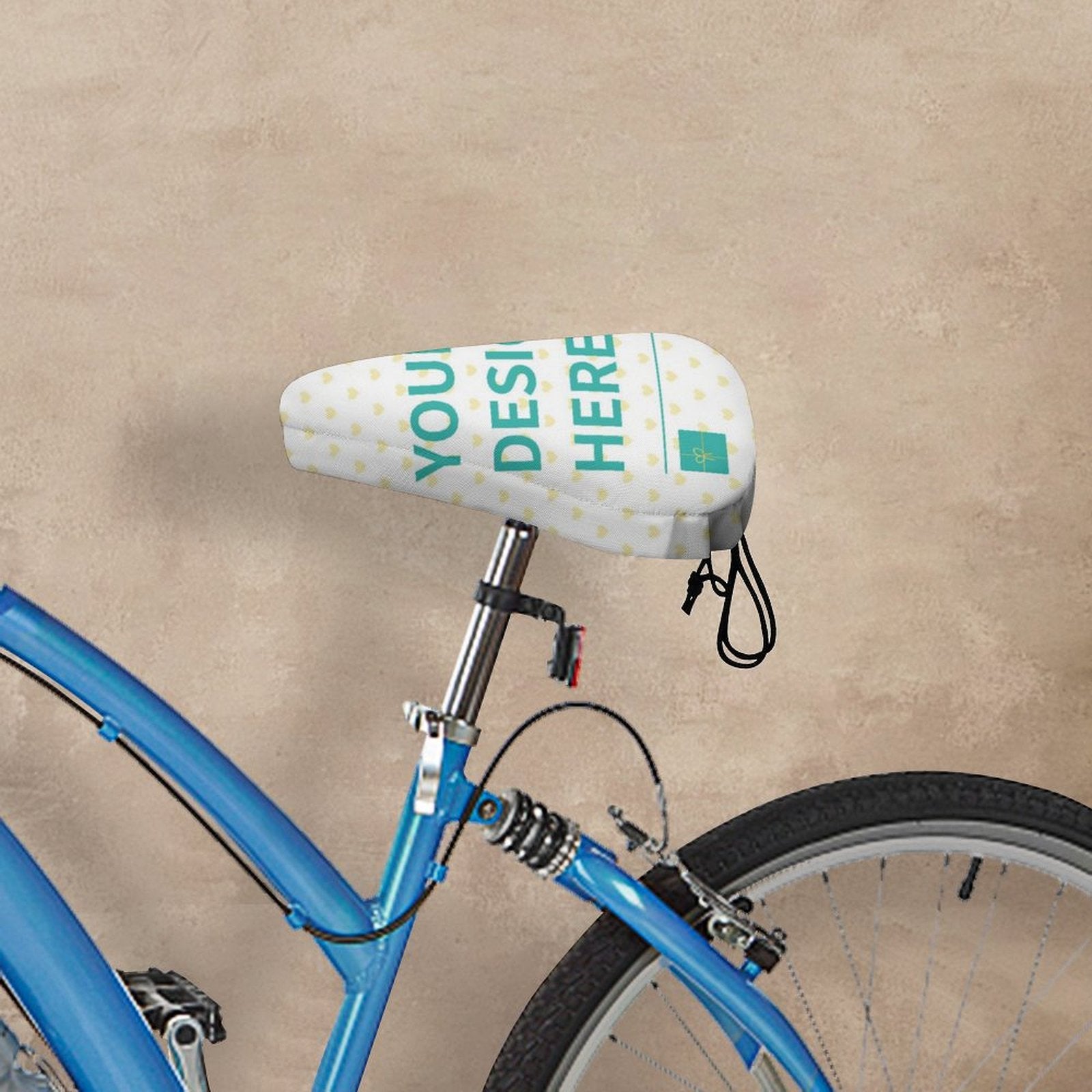 Custom bike seat cover with 'YOUR DESIGN HERE' text, waterproof, on a blue bicycle, spring buckle design